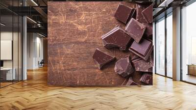 Dark chocolate pieces with natural cracks, rustic texture, placed on a wooden surface, [handcrafted dark chocolate], [natural and raw appeal] Wall mural